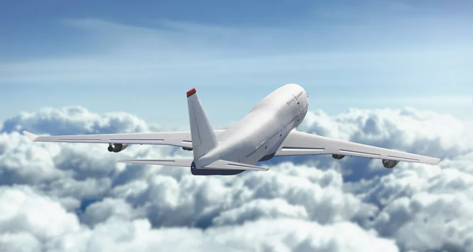 passenger jet above the clouds