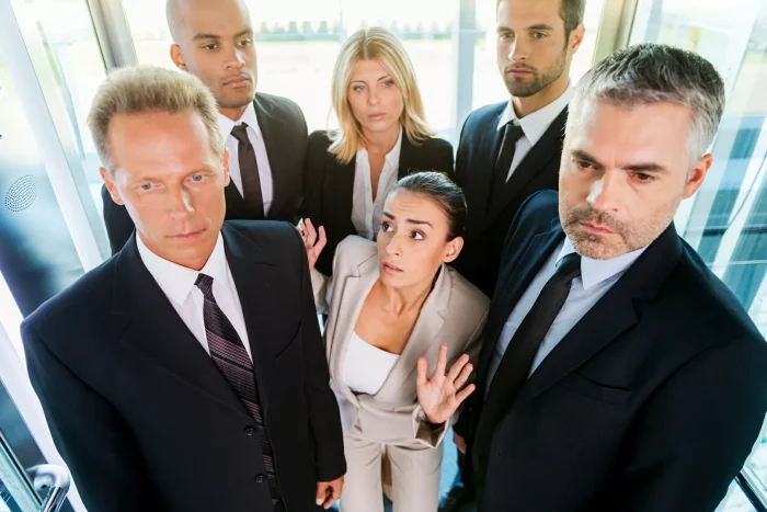 People packed tightly inside an elevator
