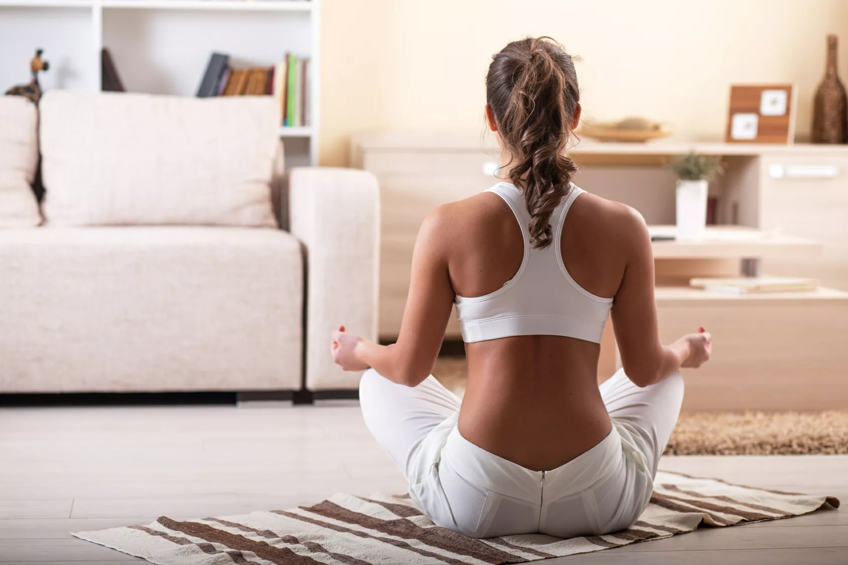 Meditation is a great way to develop mindfulness woman performing mindfulness meditation